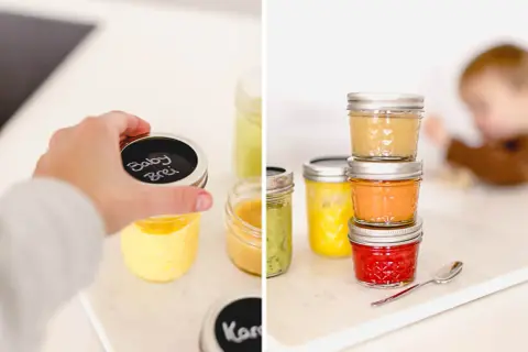 Babybrei einkochen: Gläser mit selbstgemachtem Babybrei in verschiedenen Farben, bereit zur Lagerung. Ein Kind krabbelt im Hintergrund.